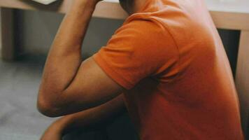 Young business man working at home with laptop and papers on desk video