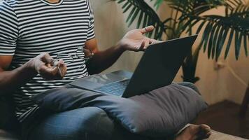 Young business man working at home with laptop and papers on desk video