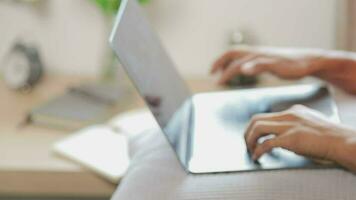 Young business man working at home with laptop and papers on desk video