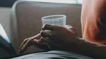 Freelancer drinking water sitting at table video