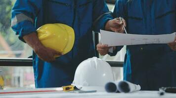 Three Heavy Industry Engineers Stand in Pipe Manufacturing Factory, Use Digital Tablet Computer, Have Discussion. Large Pipe Assembled. Design and Construction of Oil, Gas and Fuels Transport Pipeline video