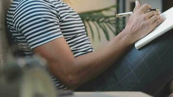 Young business man working at home with laptop and papers on desk video