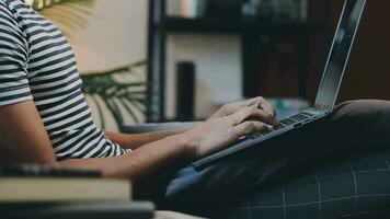 Young business man working at home with laptop and papers on desk video