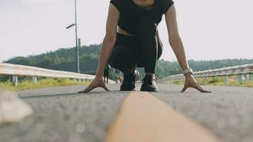 A young woman runner runs at sunset in a park in the park. video