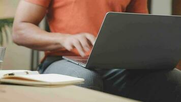 Freelancer drinking water sitting at table video