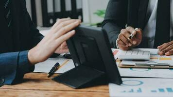 Team of business people working together in the meeting room office, teamwork background charts and graphs banner, double exposure successful teamwork,business planning concept. video