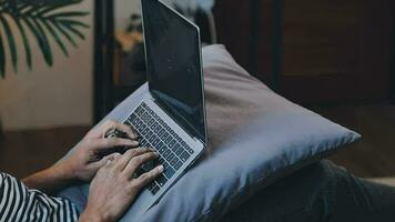 Young business man working at home with laptop and papers on desk video