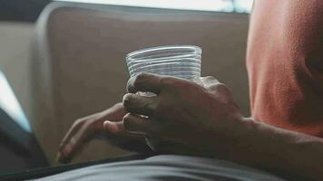 Freelancer drinking water sitting at table video