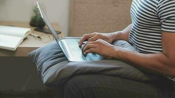 Young business man working at home with laptop and papers on desk video