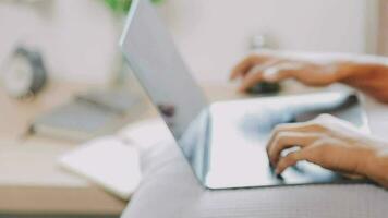 Young business man working at home with laptop and papers on desk video