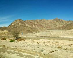 Road going through Sinai mountains, hills and desert photo