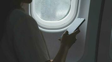 Plane cabin and a beautiful woman gazing out of the window video