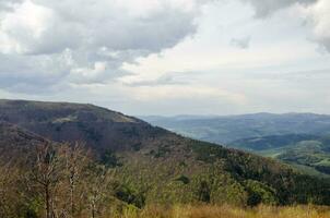 Mountains and hills, rainy clouds photo