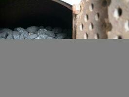 Coal in the oven, stones of coal background. Black fuel close view, coal pile at the power plant photo