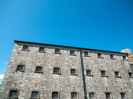 Old celtic castle tower walls, Cork City Gaol prison in Ireland. Fortress, citadel background photo