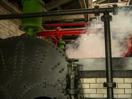 Industrial pipes at the power plant background, steam engines, ovens and boilers, factory without people photo