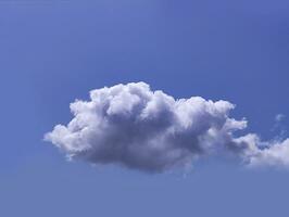 Single white cloud over blue sky background. Fluffy cumulus cloud shape photo