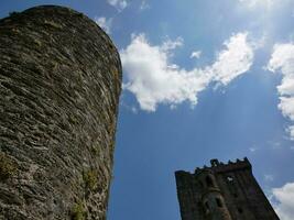 Old celtic castle towers background, Blarney castle in Ireland, old ancient celtic fortress photo