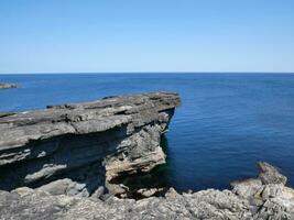 Cliffs and Atlantic ocean, rocks canyon and laguna, beauty in nature. Vacation travel background photo