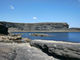 Cliffs and Atlantic ocean, clouds, rocks and laguna, beauty in nature. Vacation trip relaxation background photo