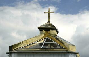 Orthodox church dome and golden Christian cross photo