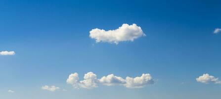 White clouds in blue summer sky photo