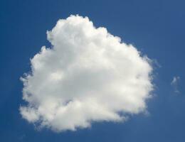 Single cloud in deep blue summer sky photo