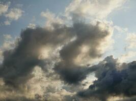 Stormy sky with white and grey clouds background, beautiful sunset heaven photo