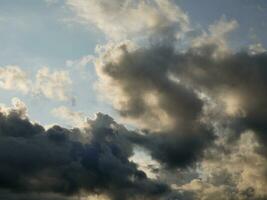 Stormy sky with white and grey clouds background, beautiful sunset heaven photo