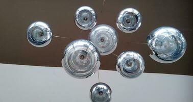 Modern chandelier background, round lamps over ceiling pattern photo