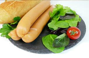 Tasty sausages and vegetables, food photography photo