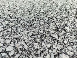 Asphalt background, sand and stones texture close view photo