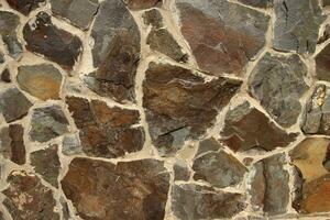Stone texture made of different shape stones photo