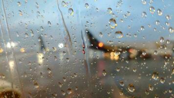 Rainy airplane field through the airplane window photo