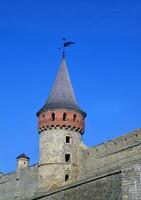 Castle wall and tower. Medieval fortification photo