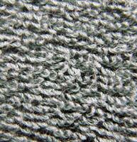 Green fluffy cloth close view photo