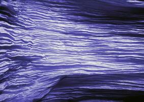 Deep blue glossy cloth texture background. Natural textile material photo, pattern cover photo