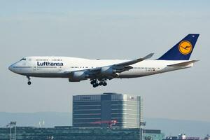 Lufthansa passenger plane at airport. Schedule flight travel. Aviation and aircraft. Air transport. Global international transportation. Fly and flying. photo