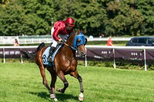 Wroclaw, Poland - Sep 10, 2023 - Jockeys competing on Wroclaw race track photo