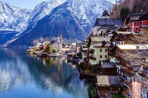 Spectacular view on the Hallstatt village from the lake border photo