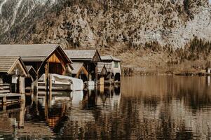 Calm lake and wooden houses on the border photo