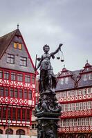 Frankfurt, Germany - Dec 25, 2018 - Justice statue in the center of the market square photo