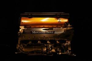 Stuttgart, Germany - Dec 27, 2018 - Close up shot of the Mercedes engine on the dark background  in the museum photo