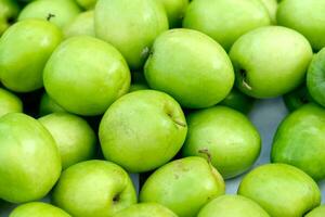 azufaifa,indio azufaifo, chino fecha, mono manzana verde pelotas pila foto