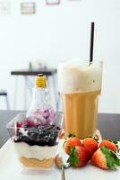 Cappuccino coffee blueberry dessert and strawberry photo