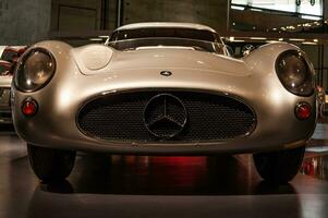 Stuttgart, Germany - Dec 27, 2018 - close up shot of the front part of silver Mercedes sports car in the museum photo