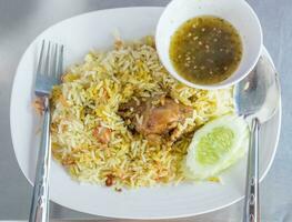 Rice with curried chicken biryani photo