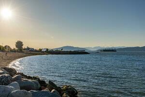 Ocean beach sunset in British Columbia photo