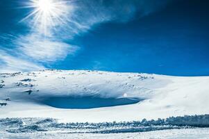 Snow desert and bright sun photo