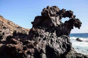 rock formations on the coast of canary islands photo